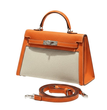 Hermès Bag | Kelly In Orange Leather And A Neutral Canvas Material